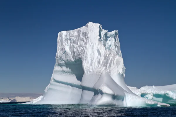 Large iceberg in Antarctic waters on a sunny summer day
