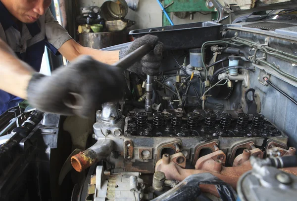 Hand repair and maintenance top of  cylinder diesel engine block