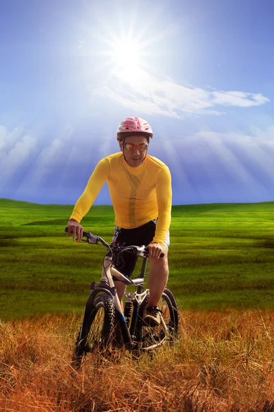 Young man wearing yellow bicycle shirt  riding mountain bike mtb