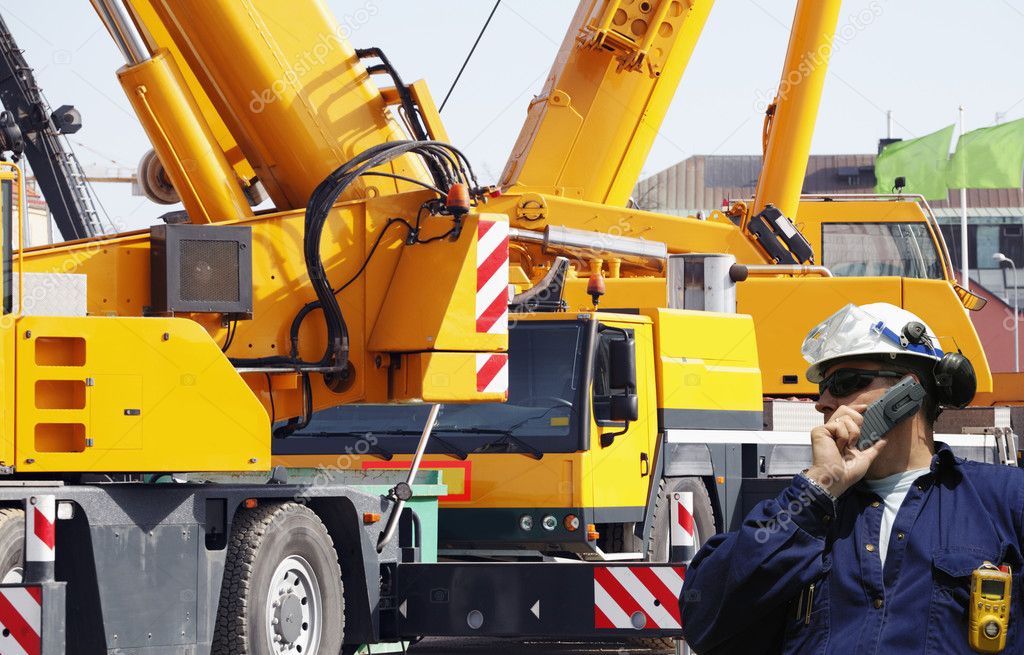 Engineer with large mobile construction cranes — Stock Photo © lagereek