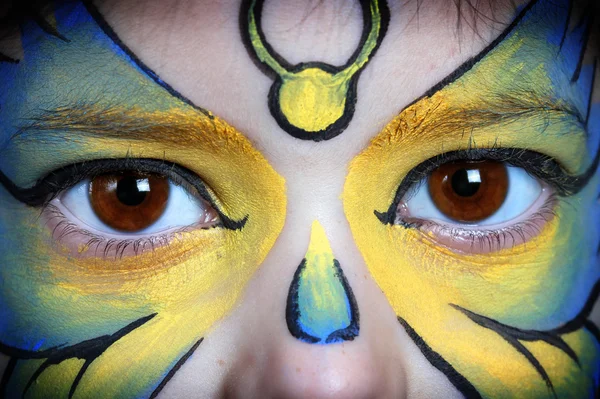 Picture of eyes from a young girl with face painting