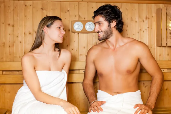 Couple having a steam bath in a sauna