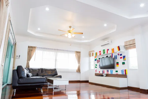 Modern room with TV and Flags for soccer championship 2014