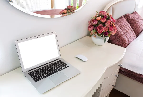 Interior of a modern bed room with laptop computer