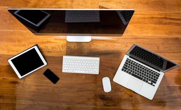 Computer ,laptop , tablet , smart phone on wood table