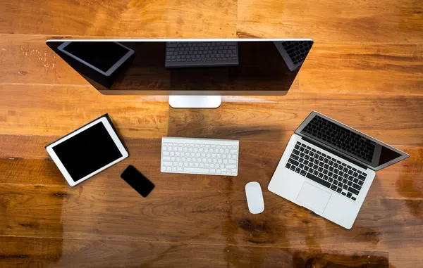 Computer ,laptop , tablet , smart phone on wood table