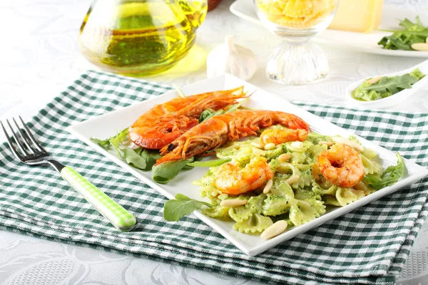 Pasta with red prawns and rocket pesto with almonds