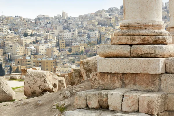Column of temple of hercules in Amman with city view