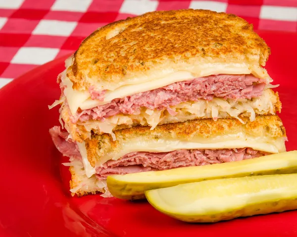 Corned Beef Reuben Sandwich - Fresh corned beef on grilled Rye with melted Swiss and sauerkraut.