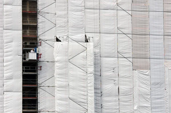 Tarpaulin on a building