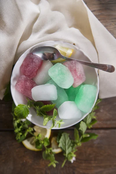 Bowl of colored ice-cubes