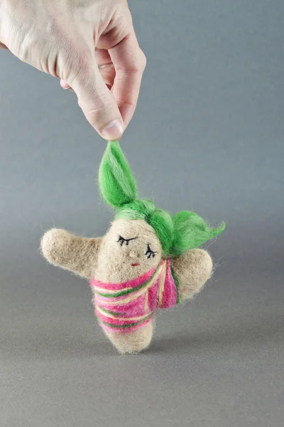 Toy girl made of wool