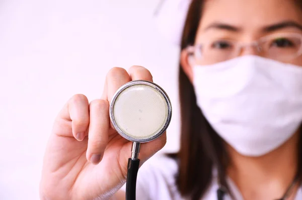 Nurse in face mask with stethoscope