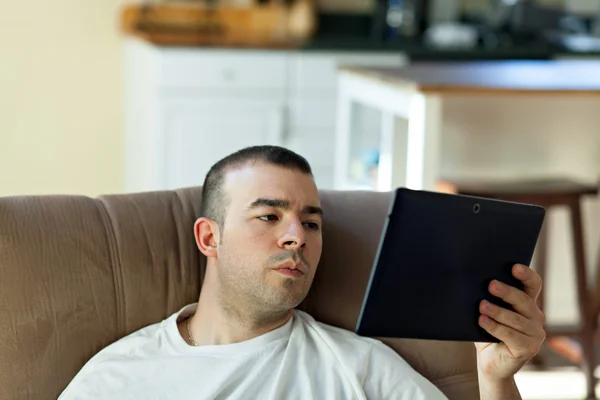 Man Reading a Tablet Computer