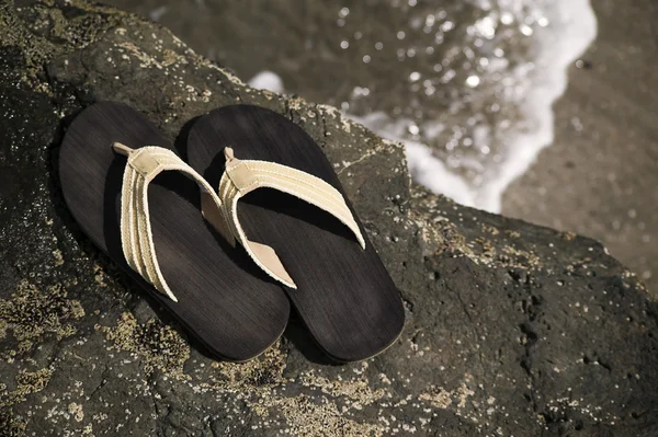 Sandals by the shore