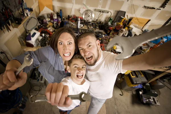 Crazy Do-It-Yourself family with wrenches