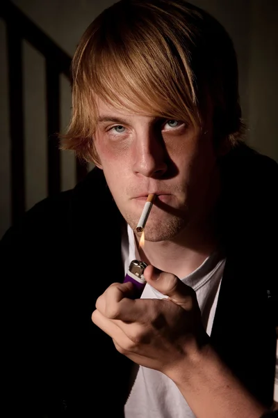 Depressed young man smoking