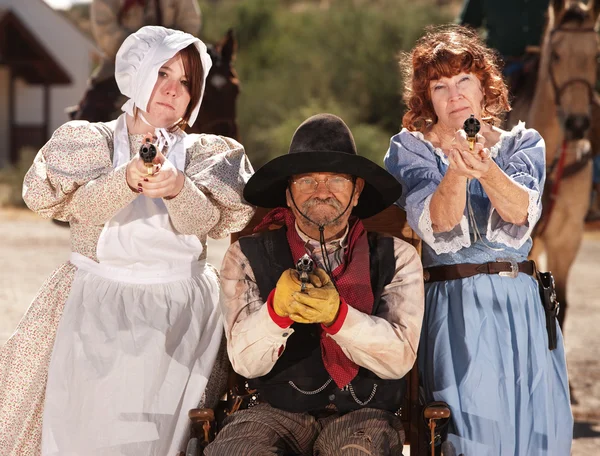 Armed Ladies and Cowboy in Wheelchair