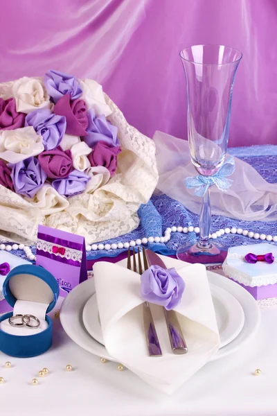 Serving fabulous wedding table in purple color on white and purple fabric b