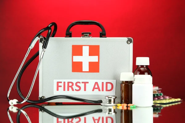 First aid box, on red background