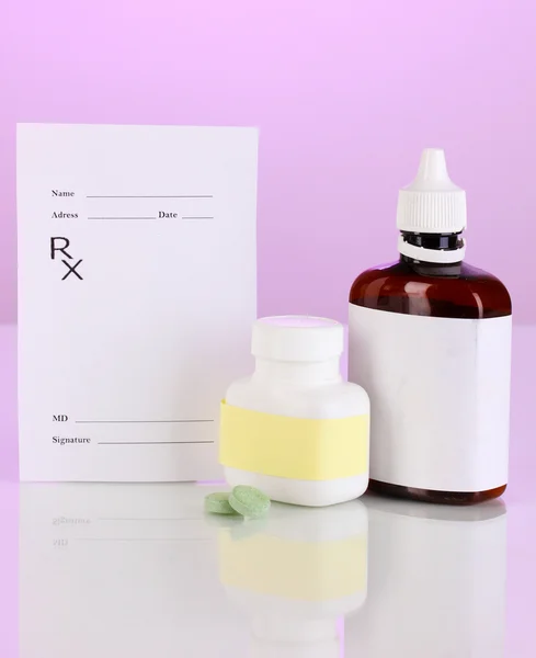 Pharmacist prescription with drops and pills isolated on purple