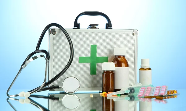 First aid box, on blue background