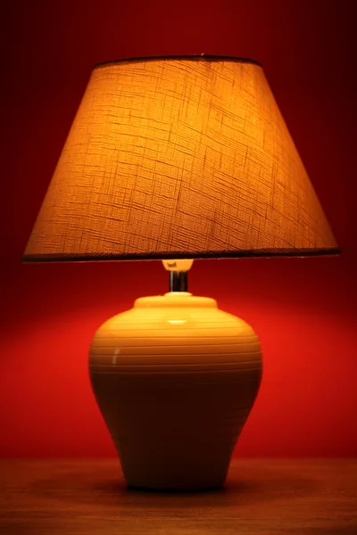 Table lamp on wallpaper background