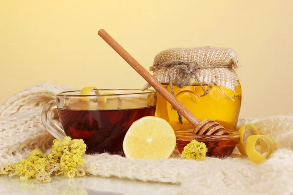 Healthy ingredients for strengthening immunity on warm scarf on yellow background