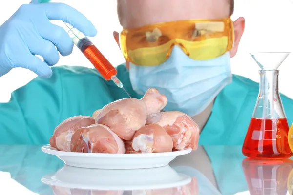 Scientist injecting GMO into the meat