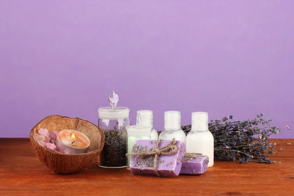 Ingredients for soap making on violet background