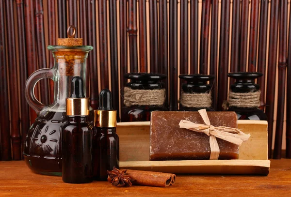 Ingredients for soap making on brown background