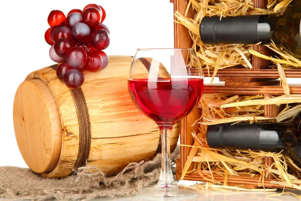 Wooden case with wine bottle, barrel, wineglass and grape isolated on white