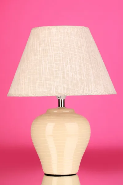 Table lamp on pink background