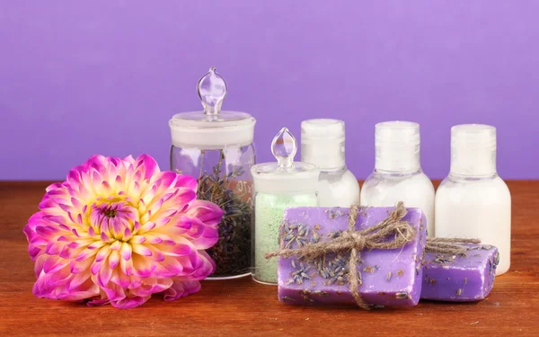 Ingredients for soap making on violet background