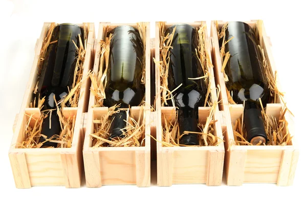Wooden case with wine bottles isolated on white