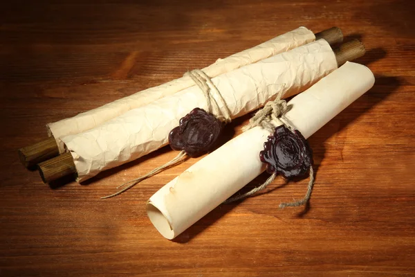 Old scrolls, on wooden background