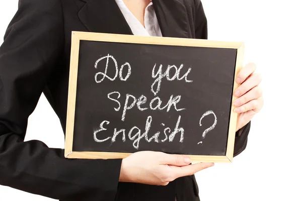 Young woman holding sign Do you speak english?