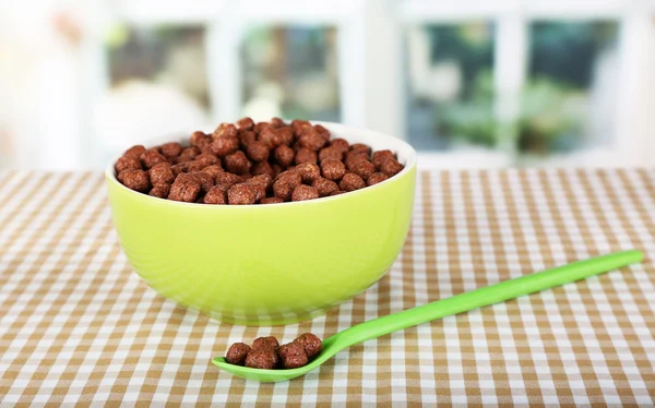 Delicious and healthy cereal in bowl on table in room