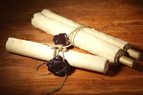 Old scrolls, on wooden background
