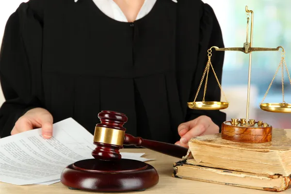 Judge sitting at table during court hearings on room background