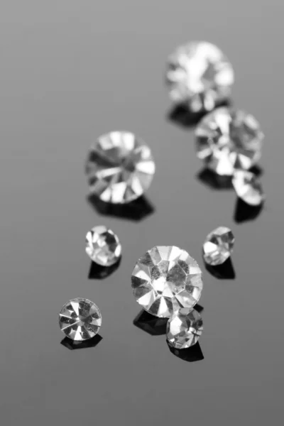 Beautiful shining crystals (diamonds), on grey background