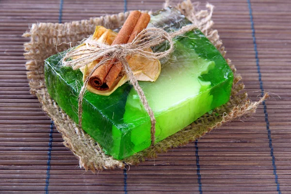 Hand-made soap on grey bamboo mat