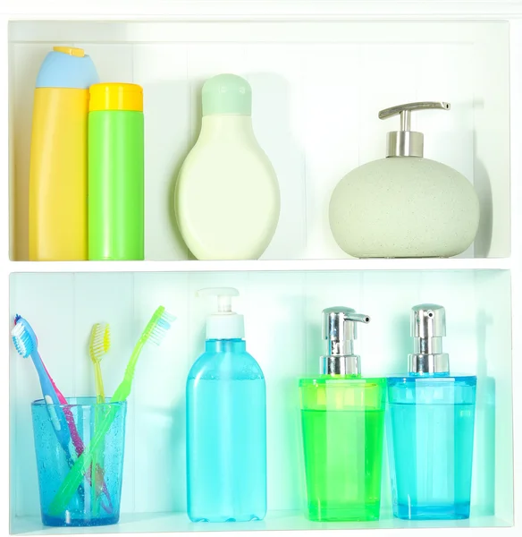 Beautiful white shelves with different bathroom objects