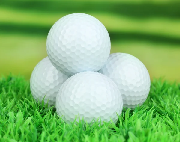 Golf balls on grass outdoor close up — Stock Photo #25767847