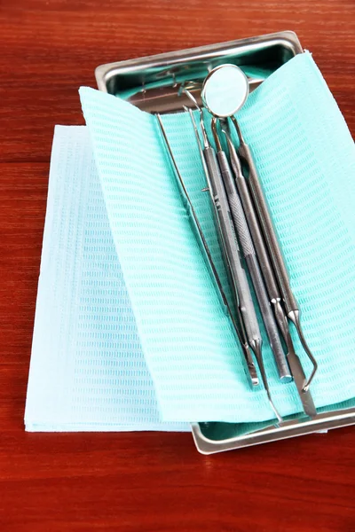 Dentist tools on wooden table