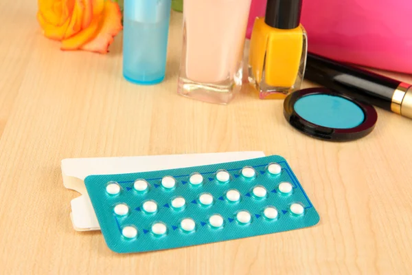 Hormonal pills in women\'s bedside table close-up
