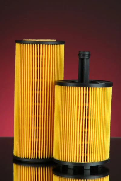 Car oil filters on dark color background