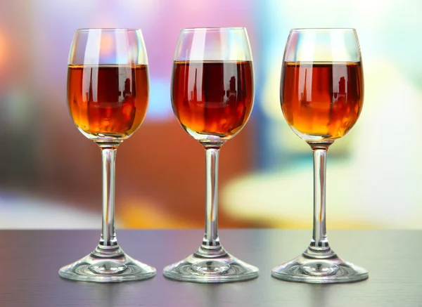 Glass of amaretto liquor, on bright background