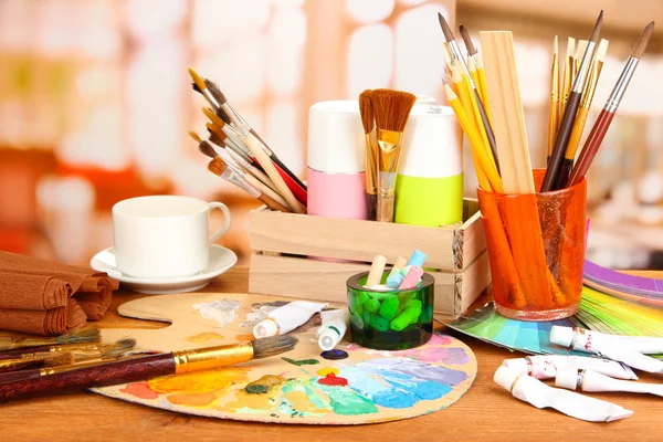 Artistic equipment: paint, brushes and art palette