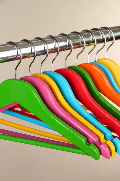 Colorful clothes hangers on gray background - Stock Image - Everypixel